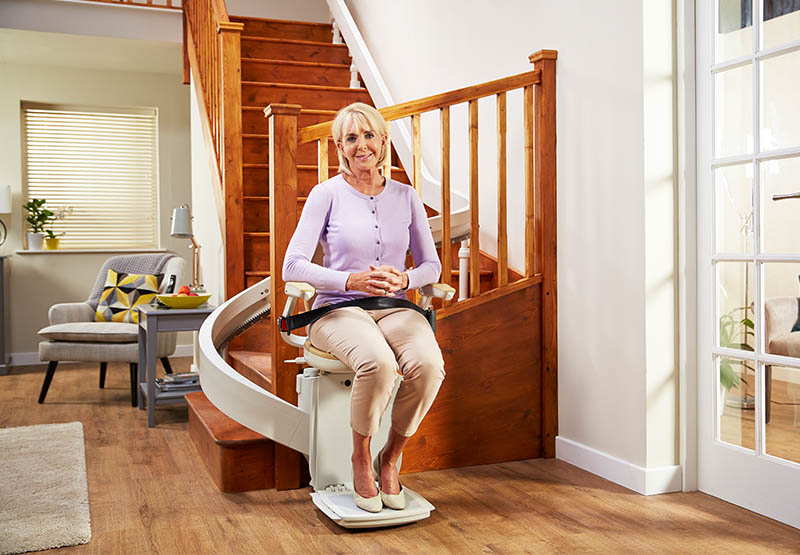 Image of Dr Hilary with Acorn 180 Curved Stairlift